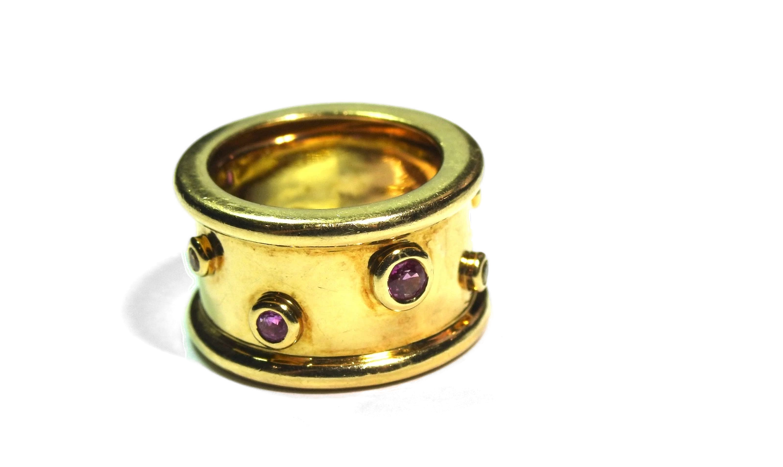 Wide gold band with gemstone accents, Jon Bragman, Inc. South Florida